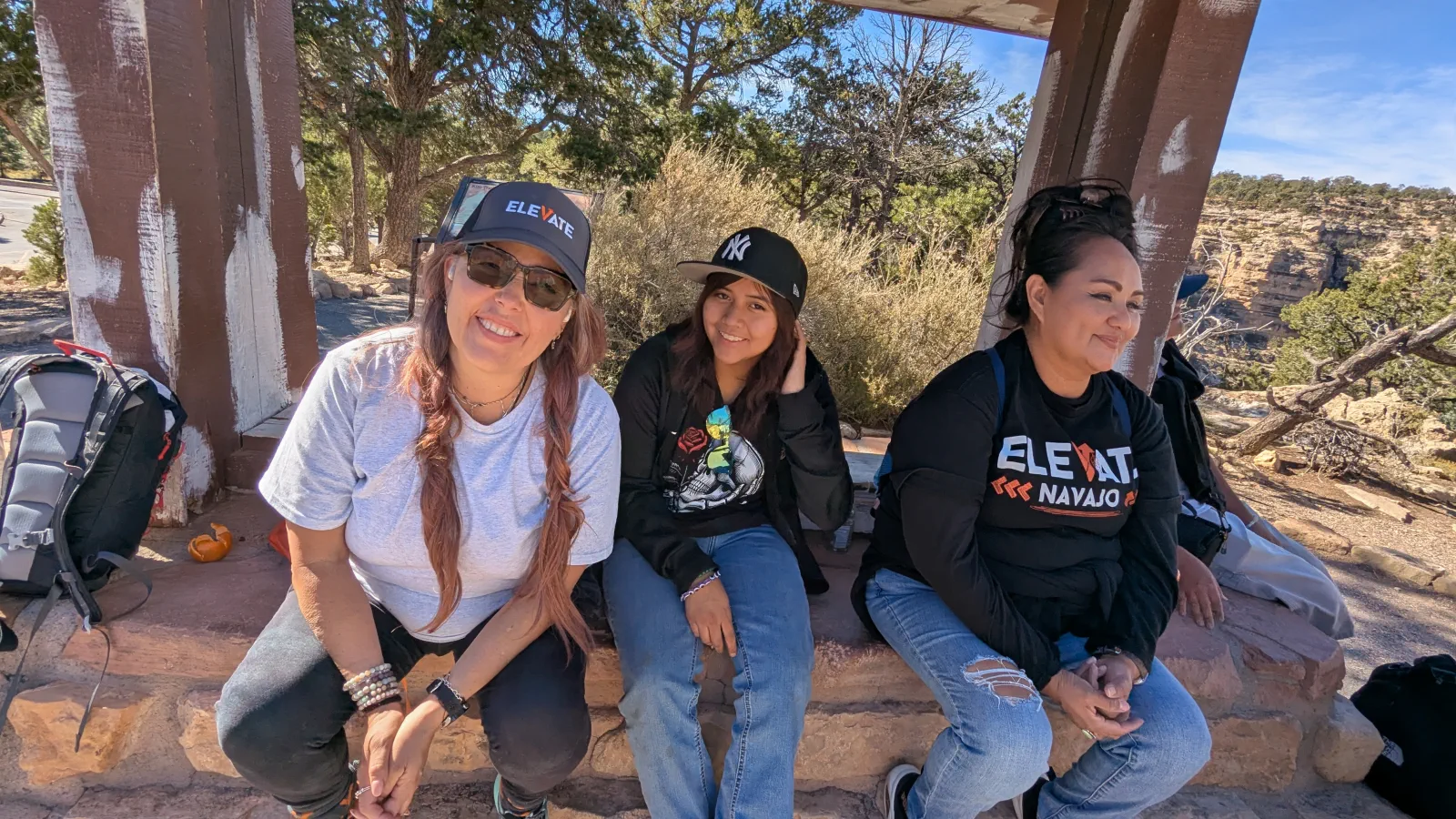 Three Elevate Navajo team members resting after time on the trail