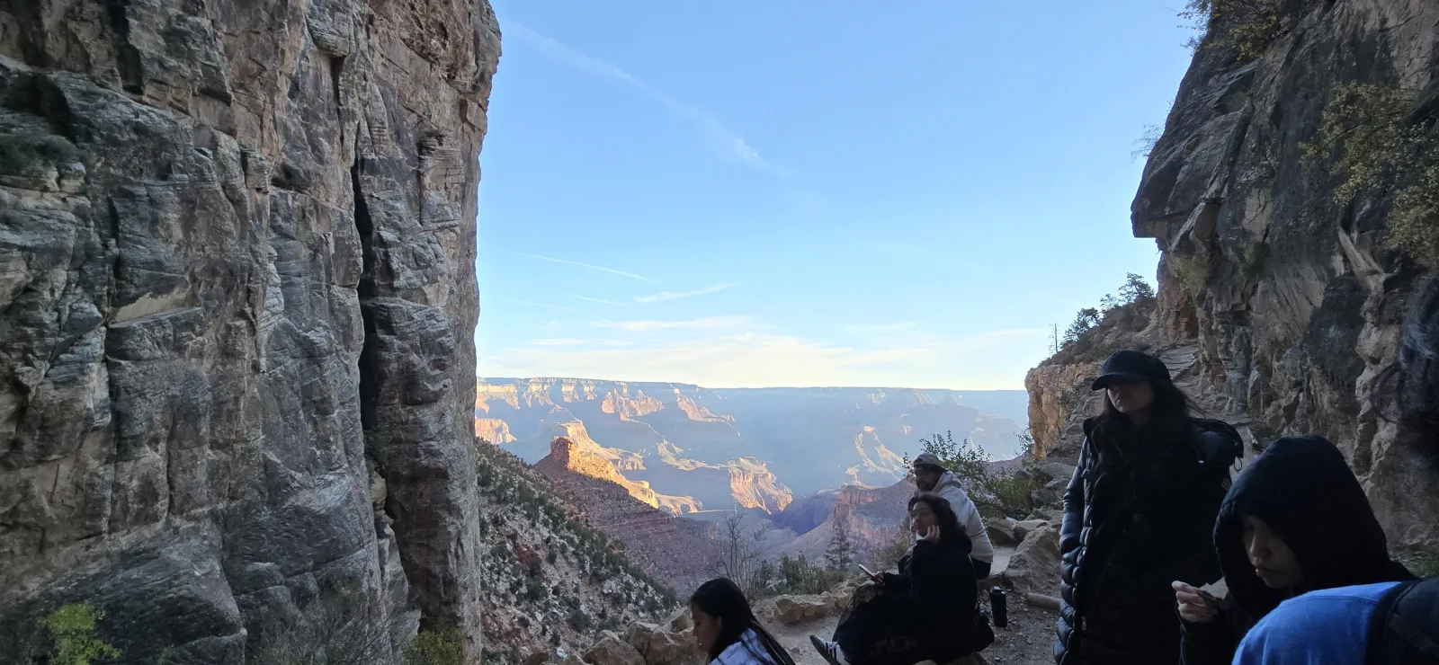 Run the Rim participants resting on a Grand Canyon trail overlook